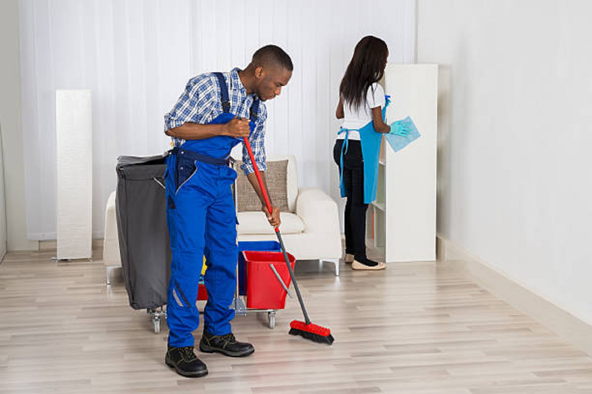 Two Cleaners With Cleaning Equipment Cleaning Apartment